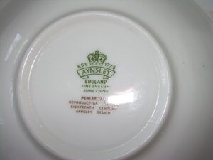 Close-up of an authentic Aynsley England green backstamp for the Pembroke pattern, used for identifying and dating vintage fine bone china